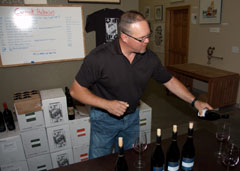 Owner/winemaker Rich Funk of Saviah Cellars pouring his Red Mountain Syrah